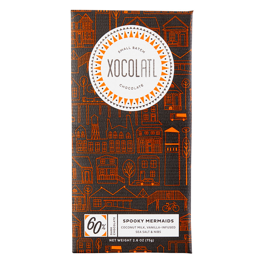 Black and orange Halloween themed wrapper on a 60% dark coconut Xocolatl bar called Spooky Mermaids
